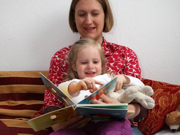 mom-reading-book-to-child-bedtime-Getty.jpg