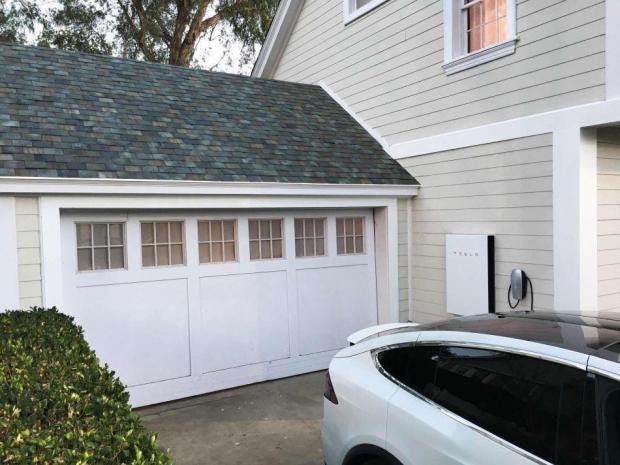 musk unveils solar roofs universal