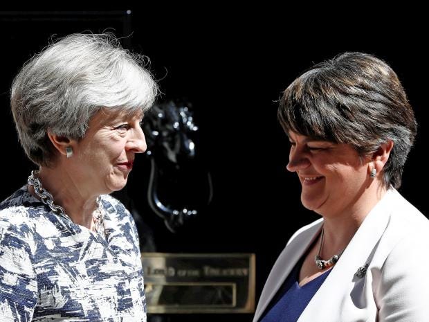 Britain's Prime Minister, Theresa May, speaks with Democratic Unionist Party (DUP) Leader Arlene Foster