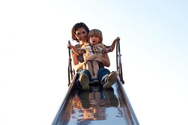 Image result for adult with child on a slide