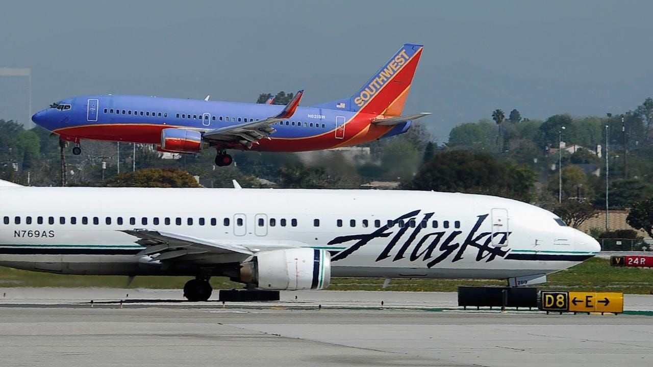 Alaska Airlines reportedly splits gay couple so straight couple could sit together pics Alaska Airlines reportedly splits gay couple so straight couple could sit together images