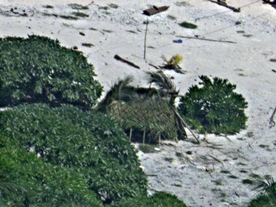 Couple Stranded On Desert Island Rescued After Writing Sos Message In Sand On Beach The 