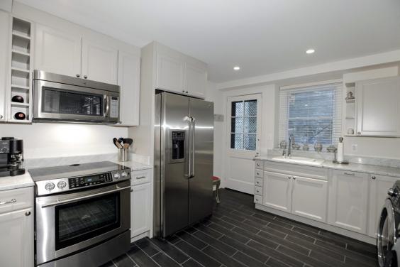 the-laundry-room-in-the-basement-doubles-as-a-second-kitchen.jpg