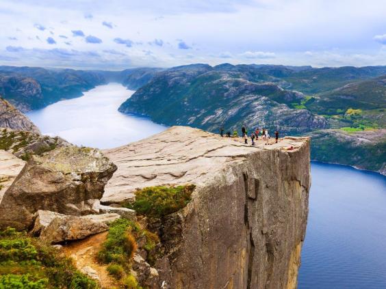 Pulpit Rock looms almost 2,000 feet over the Lysefjord in Norway. Geologists speculate that the giant mountain plateau was shaped by ice expansion about 10,000 years ago. | The Independent