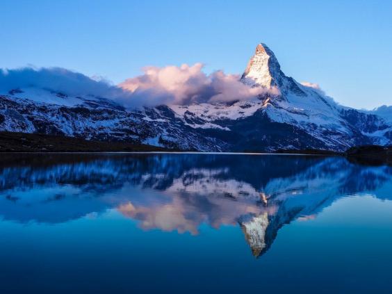 The Matterhorn is more than just a classic ride at Disneyland. The actual mountain, located in Switzerland, is known for its "chiseled rock pyramid" look, after which the Disney roller coaster was modeled. | The Independent