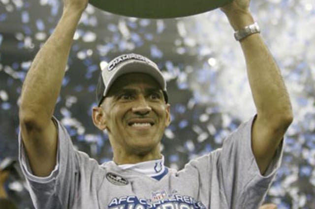 Colts coach, Dungy, celebrates winning the AFC Championship