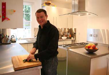 Theo Randall at home in his kitchen