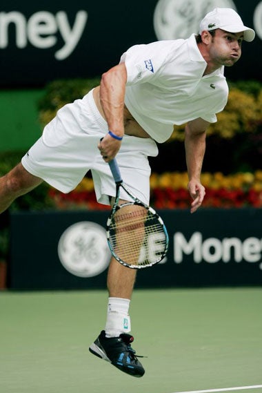 Roddick unleashes a powerful serve during his 6-3, 7-6, 6-4 victory over Marc Gicquel