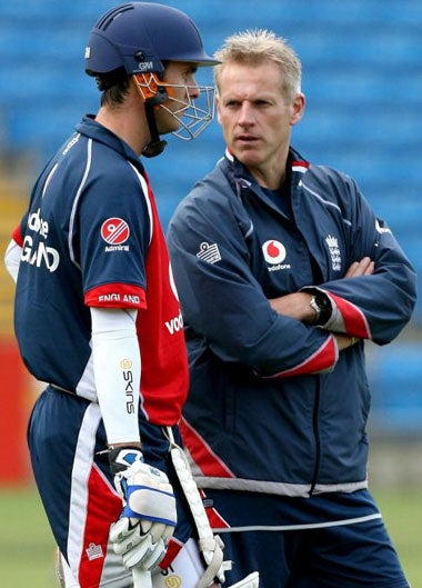 Captain Michael Vaughan talks tactics with coach Peter Moores during practice at Headingley