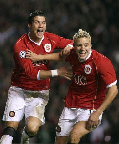 Ronaldo (left) and Alan Smith celebrate one of United's goals during the victory over Roma