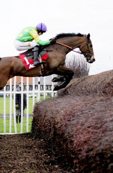 Ruby Walsh on Kauto Star clears the last at Newbury