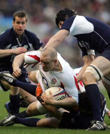 Mike Tindall battles with the Scotland defence during Saturday's win at Twickenham