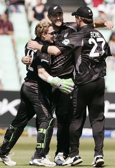 New Zealand players celebrate their 5 run win in Durban