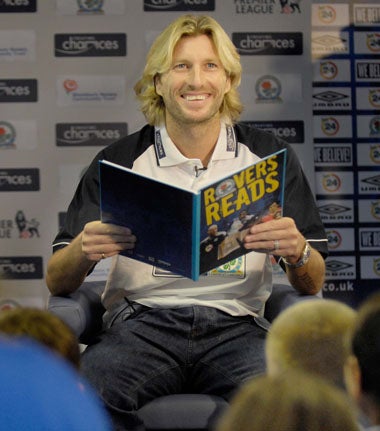 Savage reads to schoolchildren as part of the Premier League's Creating Chances programme