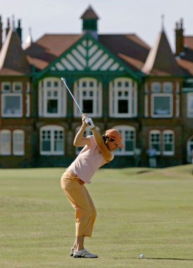 Inkster drives towards the clubhouse on her way to a 66