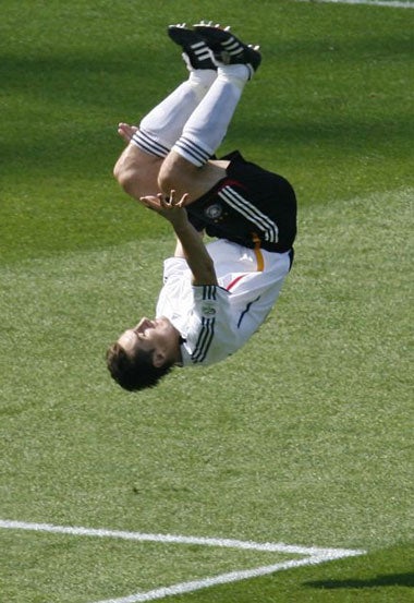 Klose celebrates one of his goals that helped beat Ecuador