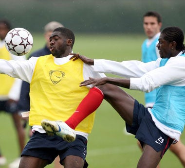 Kolo Toure (left) and Emmanuel Adebayor prepare to face Porto