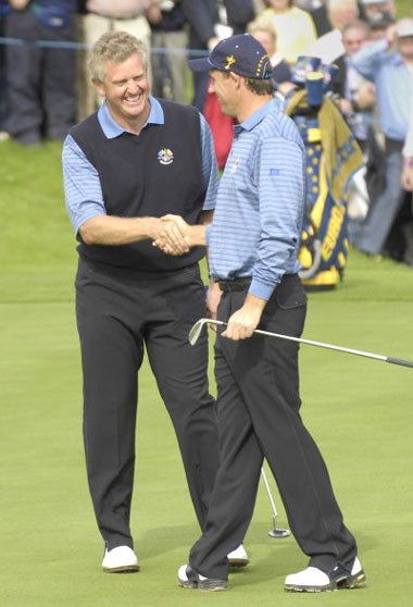 Monty congratulates Harrington (right) on making an 'impossible' bunker shot during practice