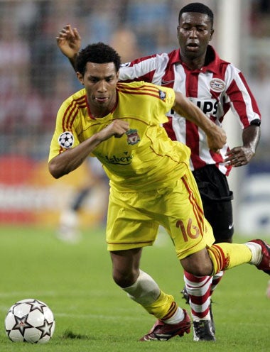 Liverpool's Jermaine Pennant takes on the PSV defence