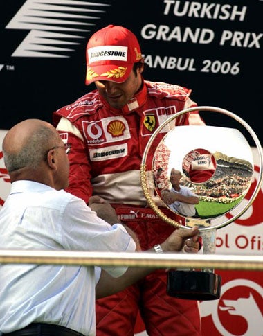 Massa receives his trophy from Mehmet Ali Talat