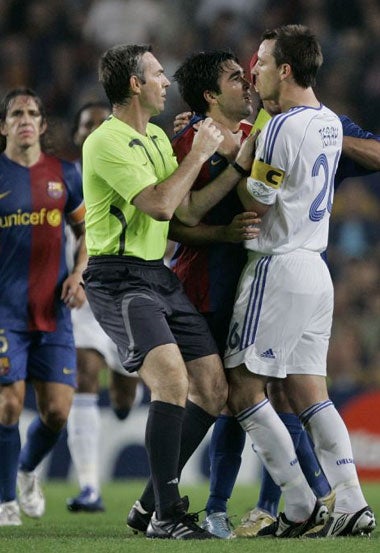 Barcelona and Chelsea players square-up to each other during their Champions' League clash