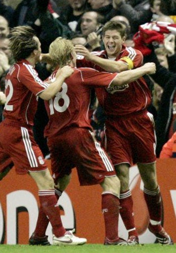 Gerrard (right) celebrates with his team-mates after his goal
