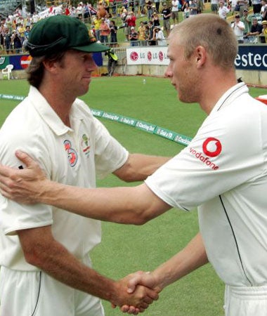 Flintoff (right) congratulates McGrath after Australia's third Ashes Test victory in Perth