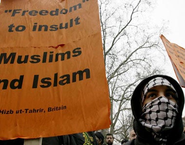 A Muslim protester joins a demonstration outside the Danish embassy in London