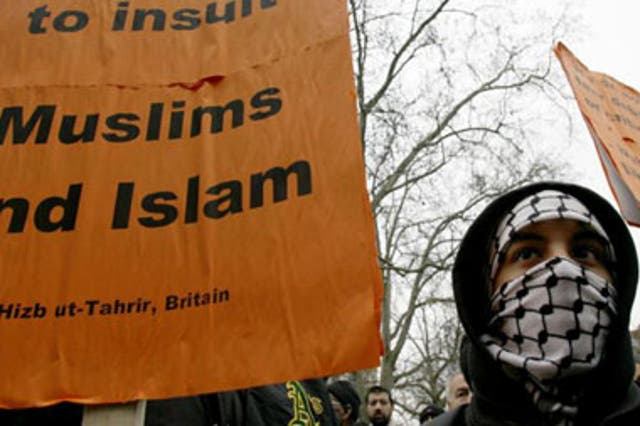 A Muslim protester joins a demonstration outside the Danish embassy in London