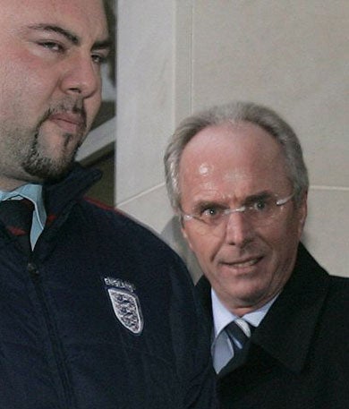 Eriksson leaves the FA yesterday escorted by a bodyguard