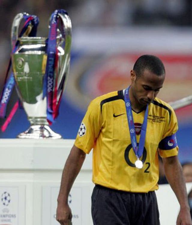 Henry trudges off the pitch after defeat in Paris before committing his future to Arsenal