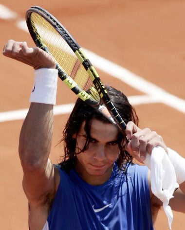 Nadal salutes the Paris crowd after Djokovic retired with an injury when trailing 6-4, 6-4
