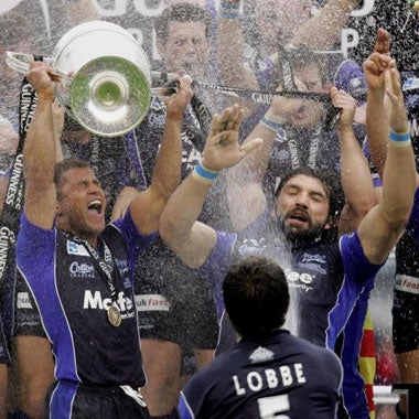 Jason Robinson lifts the trophy after Sale's win in the Premiership Grand Final
