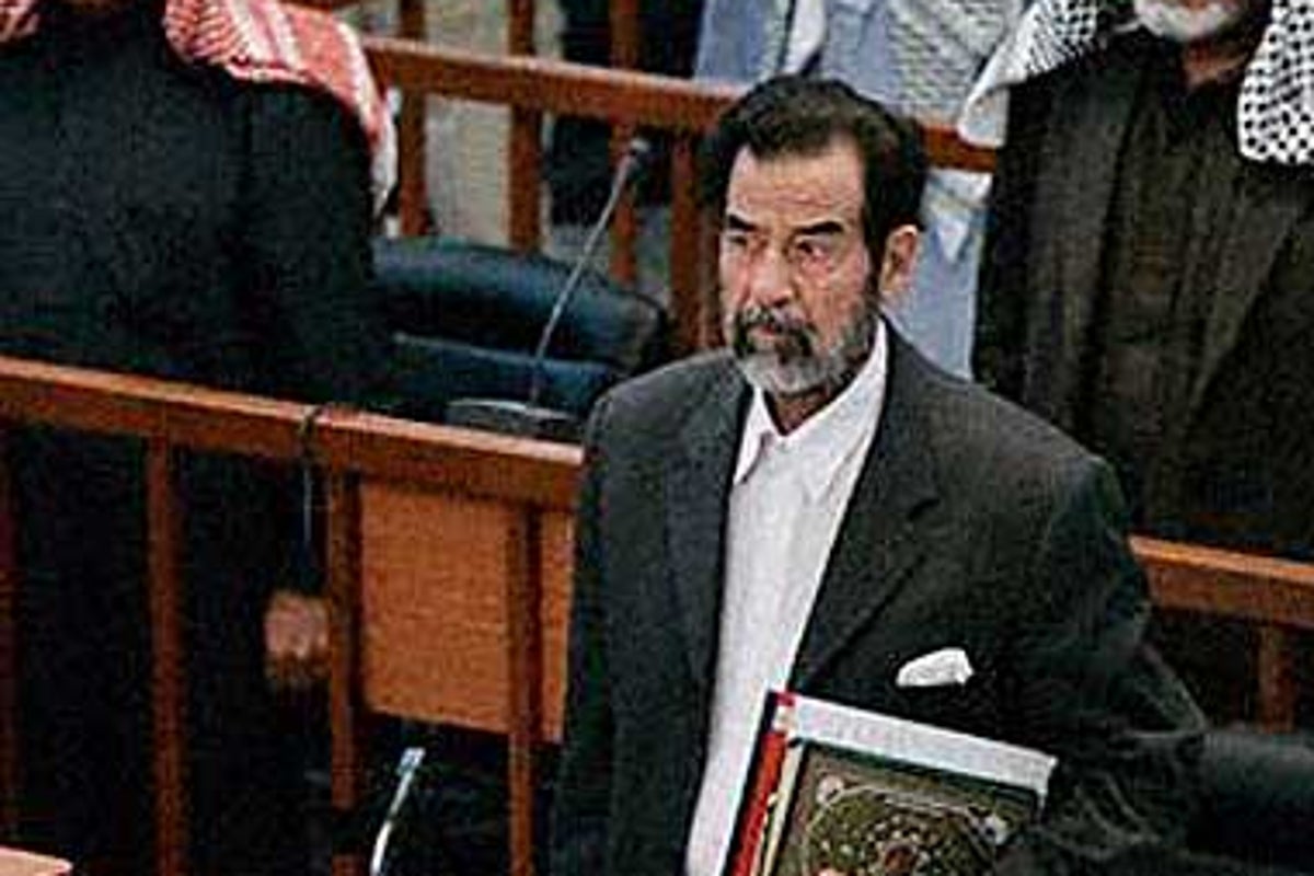 Saddam complains about chains as trial resumes | The Independent | The ...