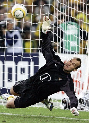 Mark Schwarzer saves during the penalty shoot-out with Uruguay