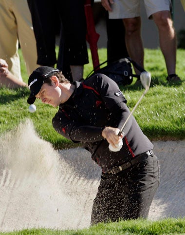 Rose chips out of a bunker on the ninth hole during his first round of 70 at the Volvo Masters
