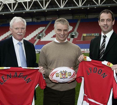 Team coach Brian Noble (centre) meets Wigan's new owners at the JJB Stadium yesterday