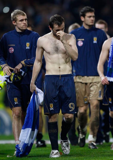 Scotland's players trudge off after defeat to Italy