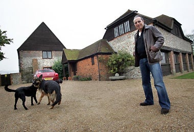 A spectre calls: Peter Jamesoutside his EastSussex home, whichdates back to theDomesday Book