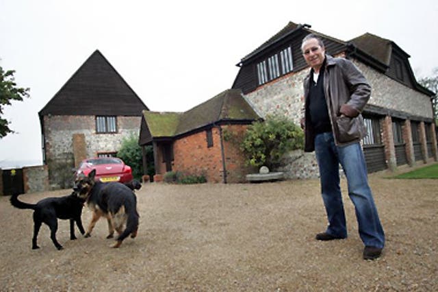 A spectre calls: Peter Jamesoutside his EastSussex home, whichdates back to theDomesday Book