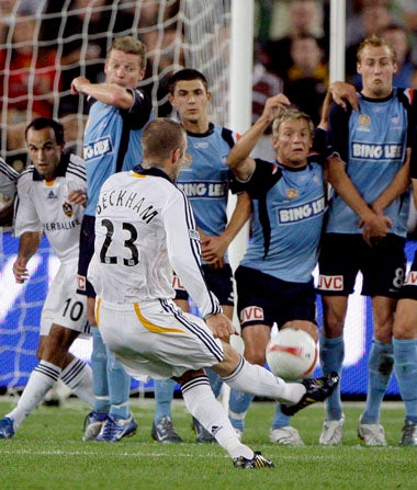 Beckham scores with a trade- mark free-kick against Sydney