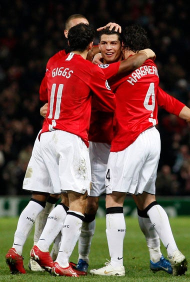 United players celebrate after Ronaldo (centre) scores the winner against his former club