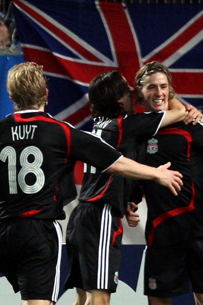 Torres (right) is congratulated by his team mates (AP)