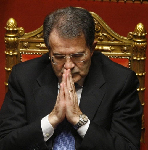 Romano Prodi joins his hands, prior to a confidence vote in the Senate