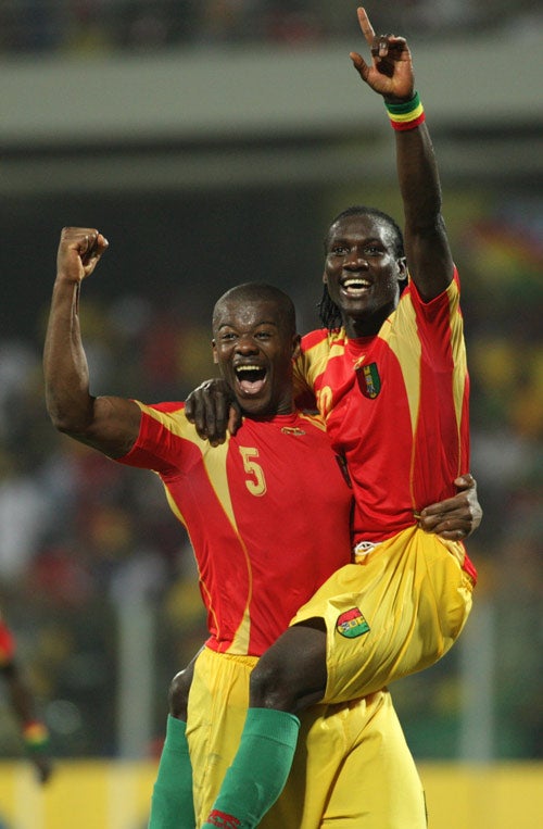 Guinea's Dian Bobo Balde (left) and Ismael Bangoura celebrate after beating Morocco