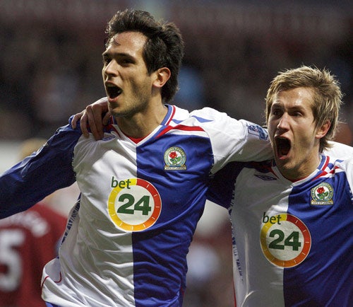 Blackburn's Roque Santa Cruz (left) celebrates his opening goal with team mate Morten Gamst Pedersen