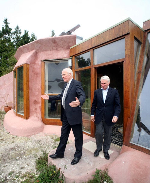 Liberal Democrat MP Menzies Campbell is shown around an environmental project called Earthship
