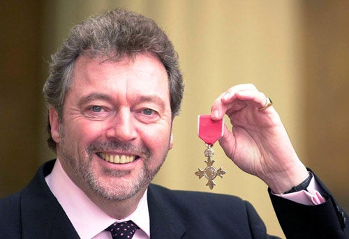Jeremy Beadle receives his OBE in 2001