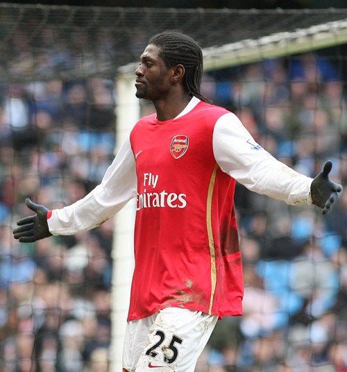 Adebayor celebrates after scoring his second goal against Manchester City