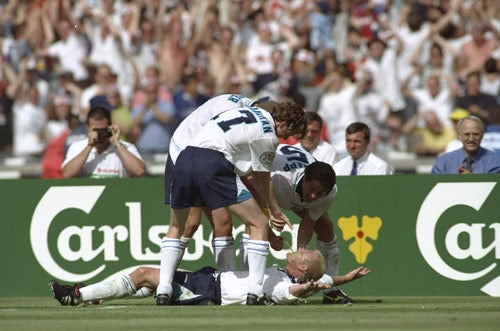 Paul Gascoigne celebrates after scoring against Scotland at Wembley during Euro 96